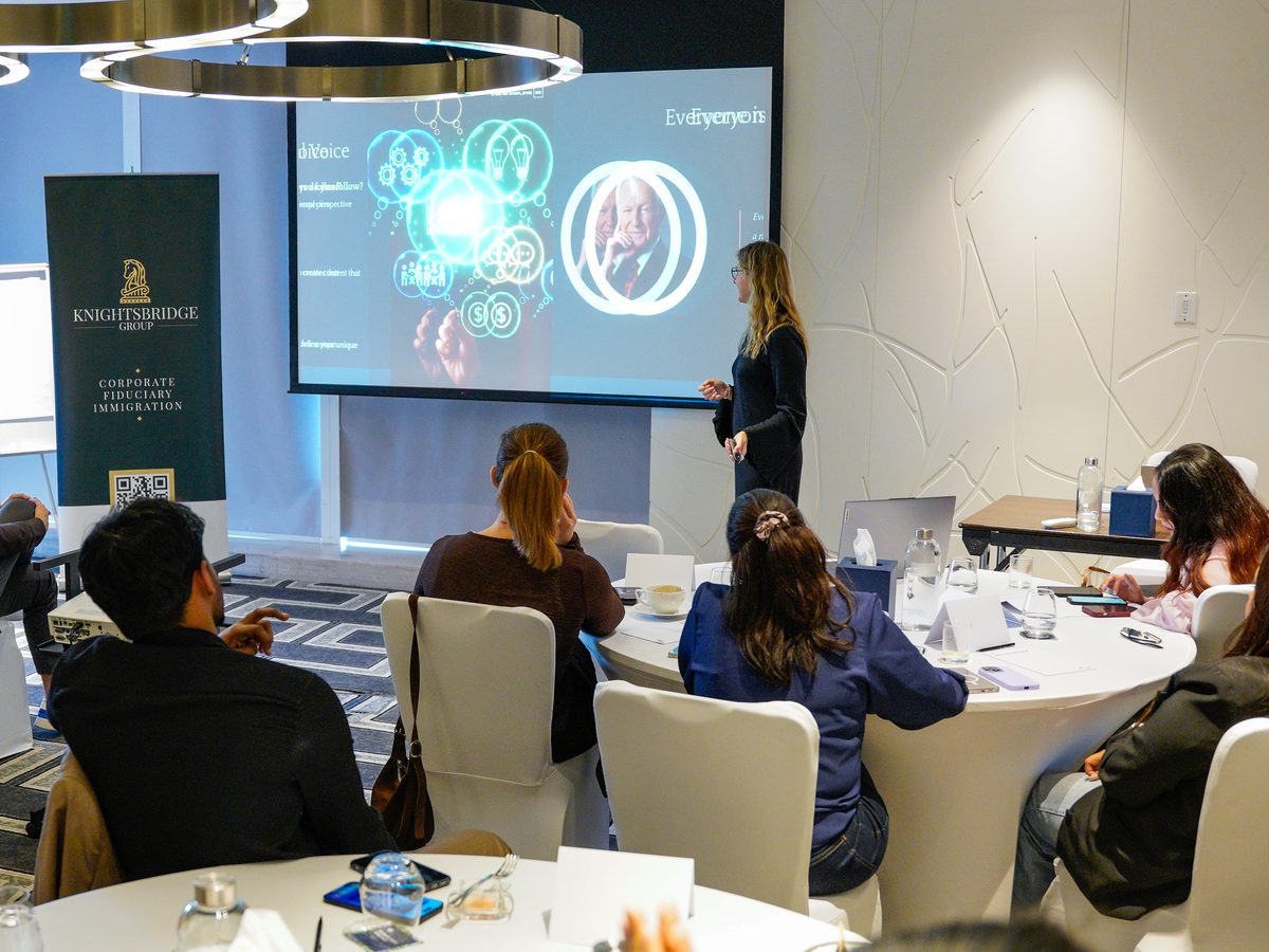Alicja Szaraniec, former LinkedIn Sales Director, running a workshop for a company team seated at round tables