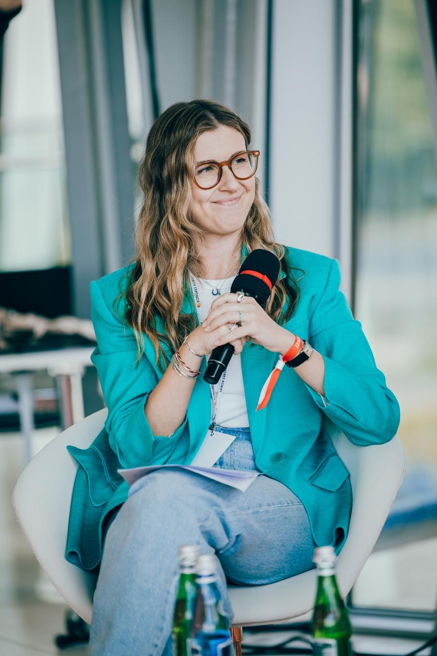 Alicja Szaraniec speaking on a panel at the XVIII Kongres Kobiet in Kraków